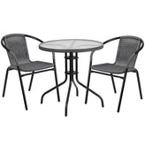 28 inch round glass metal table with black rattan edging and 2 black rattan stack chairs